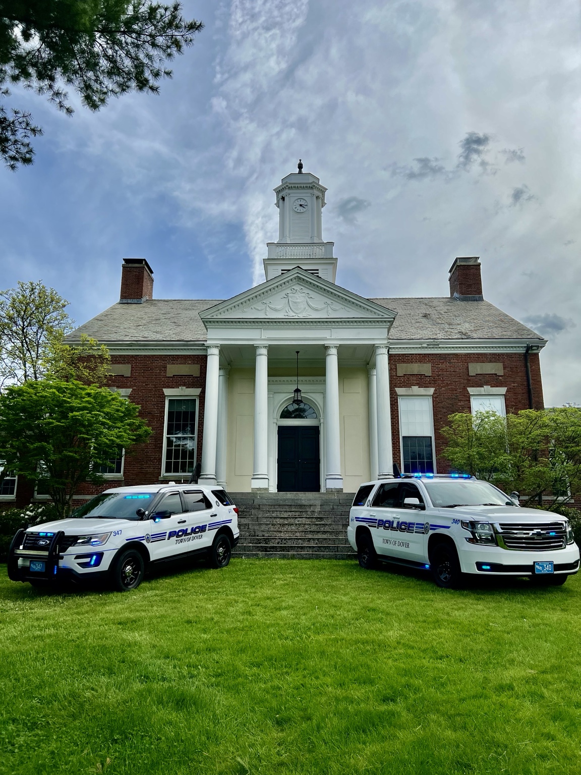 Public safety vehicles in front of a municipal building
